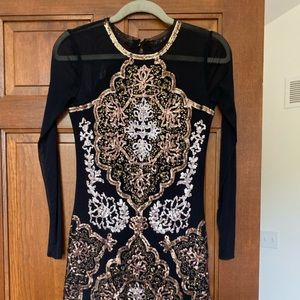 Black party dress with gold accents